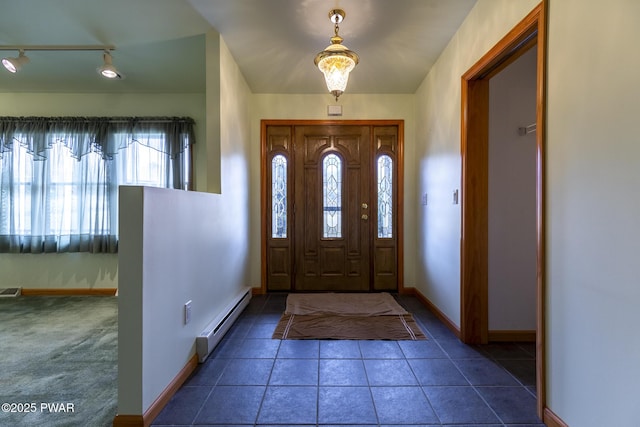 entryway with a baseboard radiator, visible vents, baseboards, and tile patterned floors