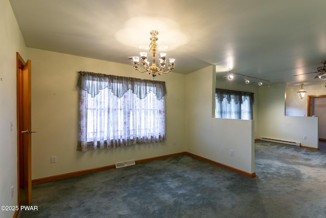 empty room with baseboard heating, carpet flooring, visible vents, and baseboards