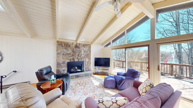 802 Rimrock Ct, Lords Valley, PA 18428 - living room with vaulted ceiling with beams, wood finished floors, ceiling fan, and a stone fireplace