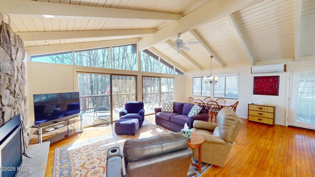 802 Rimrock Ct, Lords Valley, PA 18428 - living area featuring hardwood / wood-style floors, a wall unit AC, ceiling fan with notable chandelier, and vaulted ceiling with beams