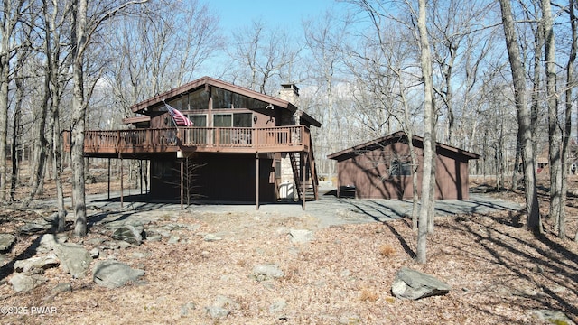802 Rimrock Ct, Lords Valley, PA 18428 - exterior space with an outbuilding, a chimney, stairs, and a deck