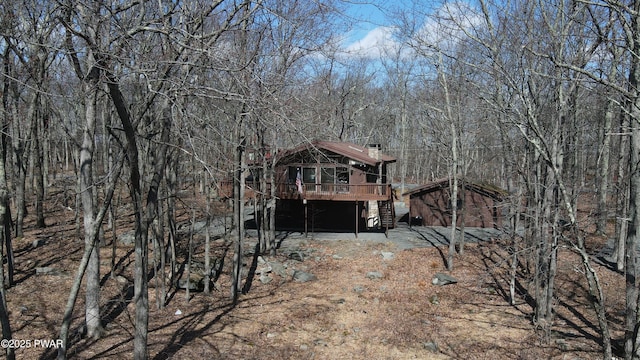 802 Rimrock Ct, Lords Valley, PA 18428 - back of property with stairs, a chimney, a wooden deck, and a wooded view