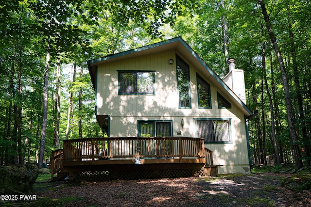 28 Lakewood Dr, Lake Ariel, PA 18436 - rear view of house featuring a wooden deck and a chimney