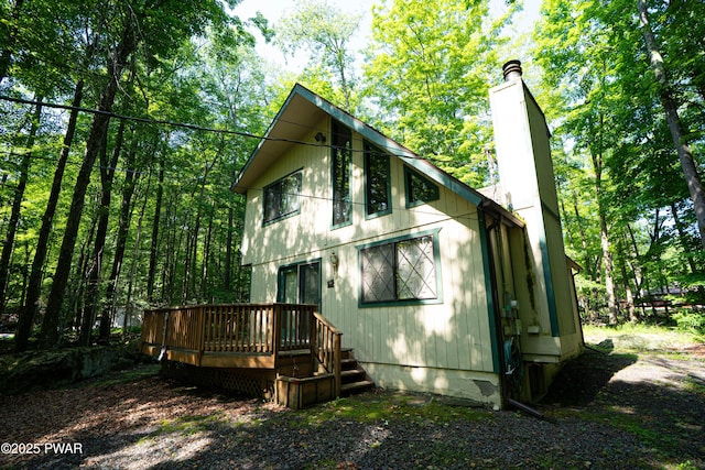 28 Lakewood Dr, Lake Ariel, PA 18436 - back of property featuring a chimney and a wooden deck