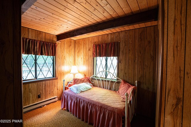 28 Lakewood Dr, Lake Ariel, PA 18436 - bedroom featuring baseboard heating, a wood ceiling with exposed beams, wood walls, and carpet floors