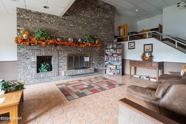 living room with a brick fireplace