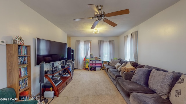 carpeted living room featuring ceiling fan