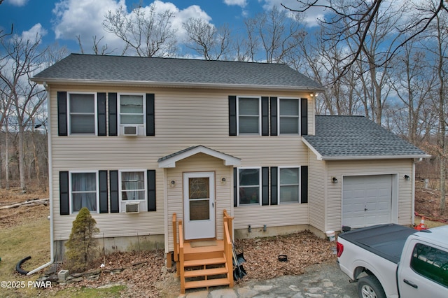 colonial-style house featuring a garage