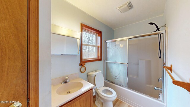 bathroom featuring a textured ceiling and toilet