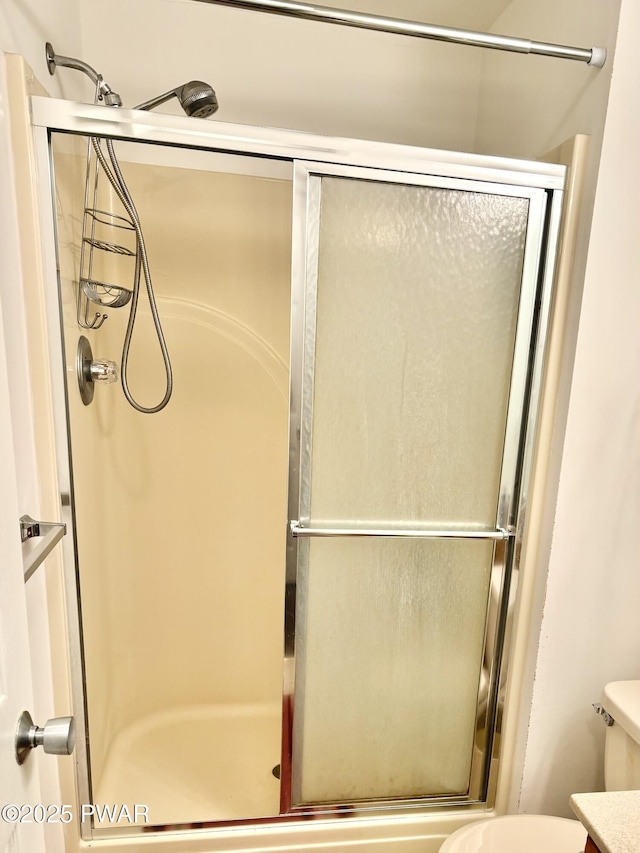 106 Keystone Ct, Dingmans Ferry, PA 18328 - bathroom with a shower with shower door and toilet