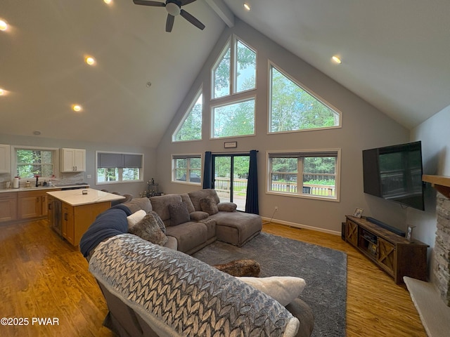 1006 Redlawn Ln, Lake Ariel, PA 18436 - living room with high vaulted ceiling, plenty of natural light, light wood-type flooring, ceiling fan, and beamed ceiling