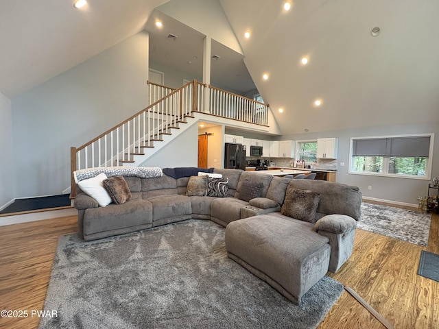 1006 Redlawn Ln, Lake Ariel, PA 18436 - living room with high vaulted ceiling, light wood-type flooring, stairway, and recessed lighting