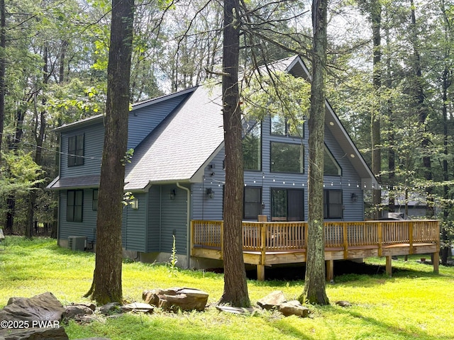 1006 Redlawn Ln, Lake Ariel, PA 18436 - rear view of house featuring a deck, roof with shingles, and a lawn