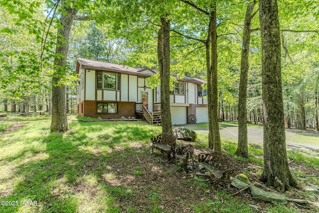 53 Windsor Rd, Hawley, PA 18428 - view of front of house with a garage, driveway, and a front yard