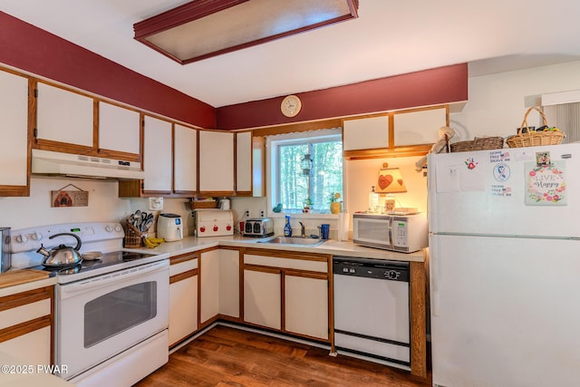 53 Windsor Rd, Hawley, PA 18428 - kitchen with white appliances, under cabinet range hood, light countertops, dark wood-style floors, and white cabinetry
