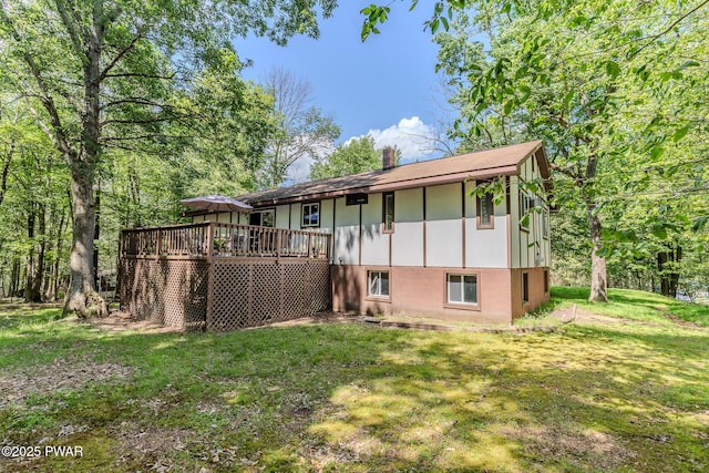 53 Windsor Rd, Hawley, PA 18428 - rear view of house with a deck, a yard, and a chimney