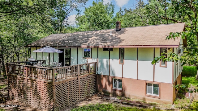 53 Windsor Rd, Hawley, PA 18428 - back of property featuring a deck, a shingled roof, and a chimney