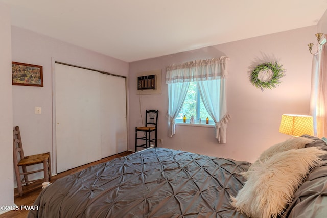 53 Windsor Rd, Hawley, PA 18428 - bedroom featuring a wall mounted air conditioner, a closet, and wood finished floors
