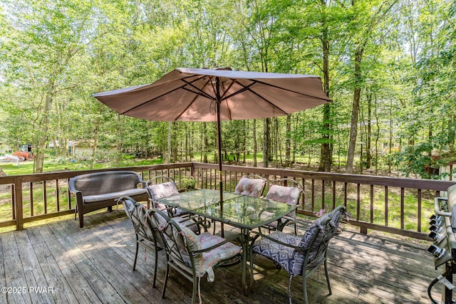 53 Windsor Rd, Hawley, PA 18428 - wooden terrace featuring outdoor dining space and a view of trees