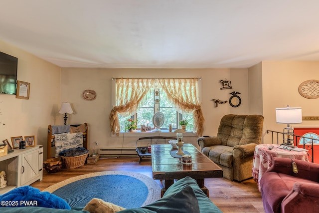 53 Windsor Rd, Hawley, PA 18428 - living area with wood finished floors and a baseboard heating unit