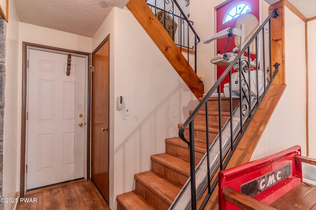 53 Windsor Rd, Hawley, PA 18428 - entryway with stairs, wood finished floors, and a textured ceiling