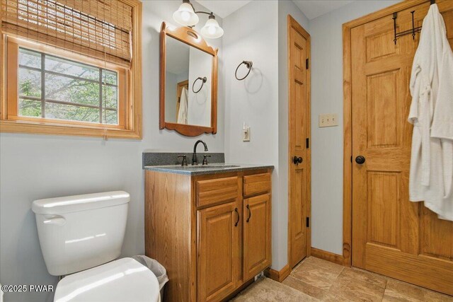 1057 K Ln, Gouldsboro, PA 18424 - bathroom featuring toilet, vanity, and baseboards