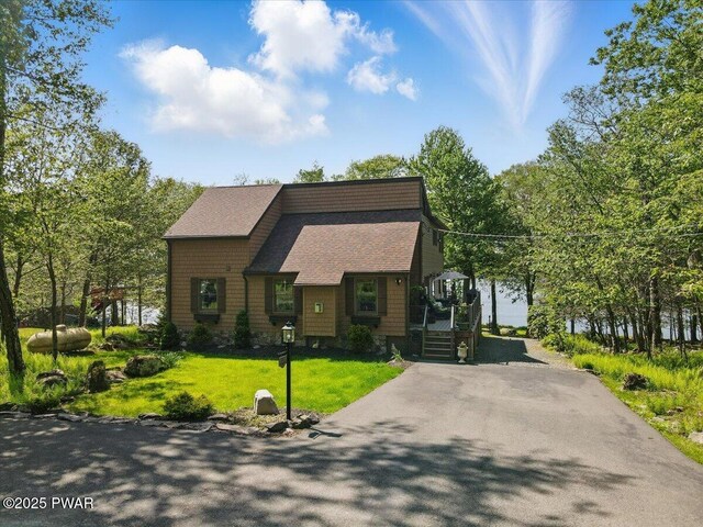 1057 K Ln, Gouldsboro, PA 18424 - view of front facade with a front yard, a shingled roof, and asphalt driveway