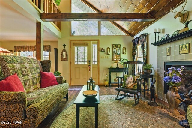 1057 K Ln, Gouldsboro, PA 18424 - living room with healthy amount of natural light, wood finished floors, wood ceiling, and a tile fireplace