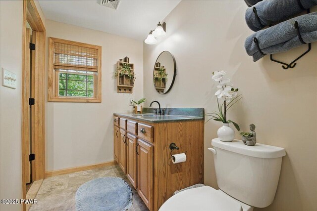 1057 K Ln, Gouldsboro, PA 18424 - half bathroom featuring vanity, toilet, and baseboards