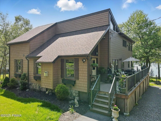 1057 K Ln, Gouldsboro, PA 18424 - view of front of house with a shingled roof and a wooden deck