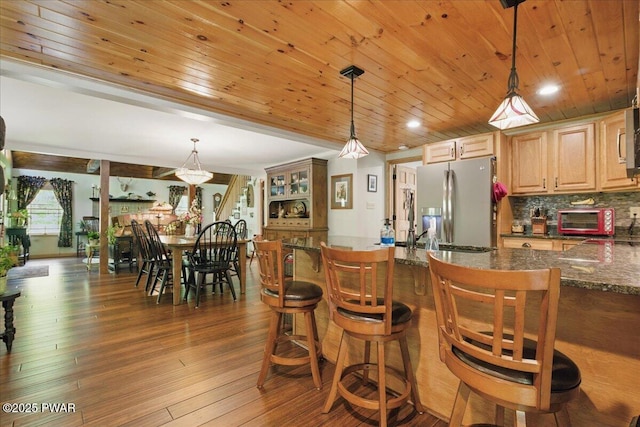 1057 K Ln, Gouldsboro, PA 18424 - kitchen featuring stainless steel fridge with ice dispenser, wood ceiling, tasteful backsplash, hardwood / wood-style flooring, and a kitchen breakfast bar