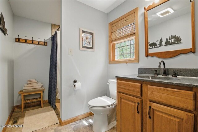 1057 K Ln, Gouldsboro, PA 18424 - bathroom with toilet, vanity, a shower with curtain, and baseboards