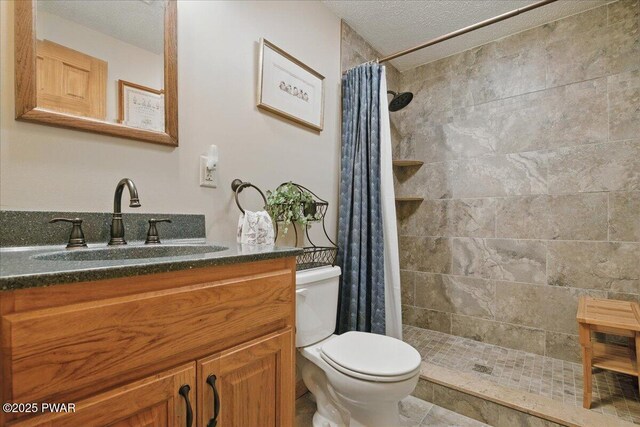 1057 K Ln, Gouldsboro, PA 18424 - full bath featuring toilet, a textured ceiling, vanity, and tiled shower