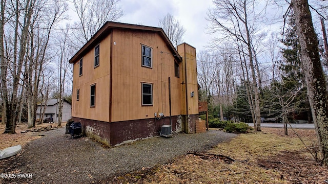 view of side of property with central AC