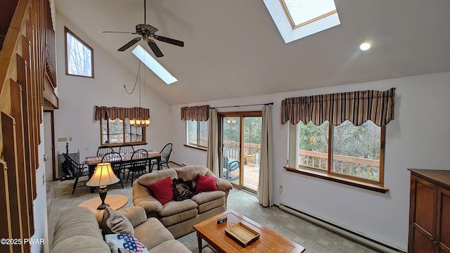 living room featuring baseboard heating, a skylight, ceiling fan, and high vaulted ceiling