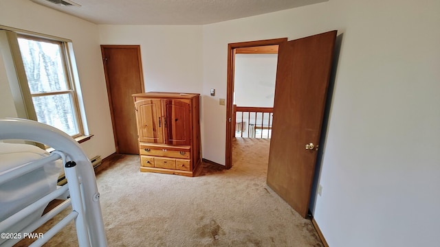 bedroom featuring multiple windows, carpet flooring, and baseboards