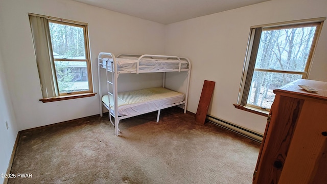 carpeted bedroom with baseboard heating