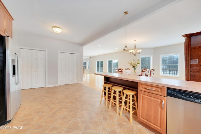 129 Lakewood Dr, Dingmans Ferry, PA 18328 - kitchen with stainless steel appliances, healthy amount of natural light, a chandelier, light countertops, and recessed lighting