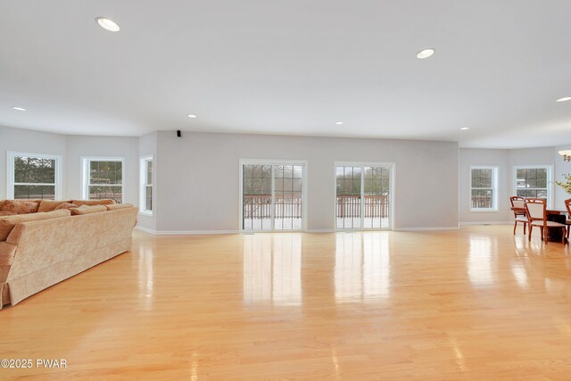 129 Lakewood Dr, Dingmans Ferry, PA 18328 - living area with light wood finished floors, recessed lighting, and a chandelier