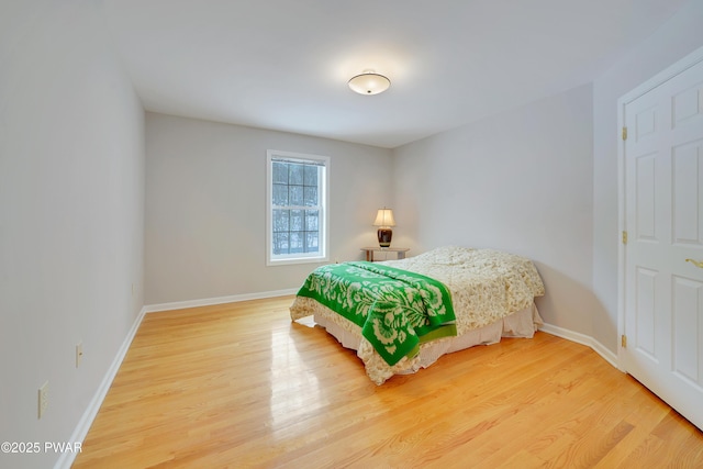 129 Lakewood Dr, Dingmans Ferry, PA 18328 - bedroom with light wood-type flooring and baseboards
