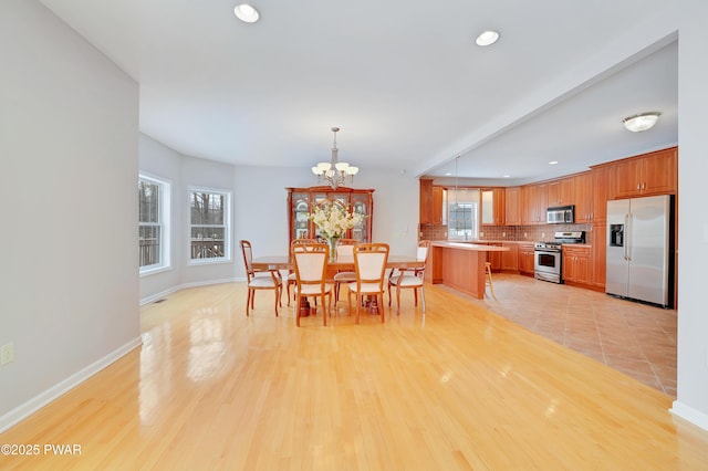 129 Lakewood Dr, Dingmans Ferry, PA 18328 - dining area with recessed lighting, a chandelier, and light wood finished floors