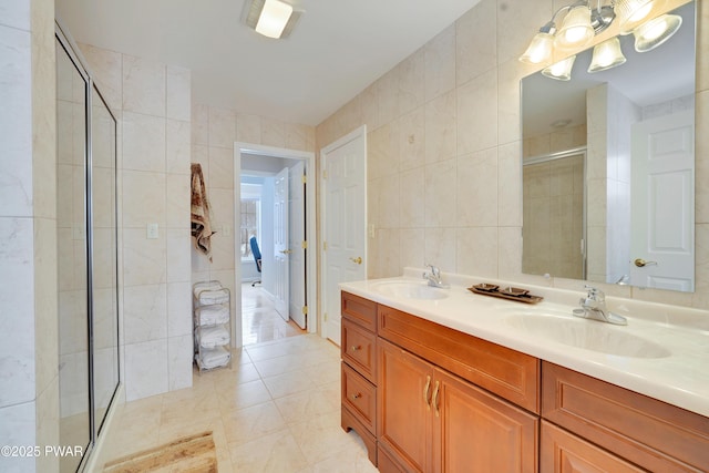 129 Lakewood Dr, Dingmans Ferry, PA 18328 - full bathroom featuring tile walls, a stall shower, and double vanity