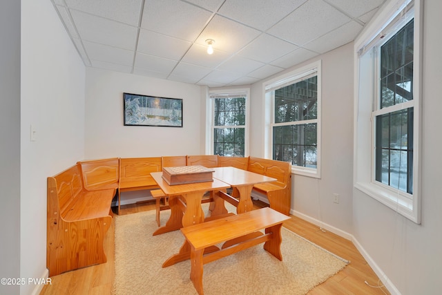 129 Lakewood Dr, Dingmans Ferry, PA 18328 - dining area featuring breakfast area, light wood-style floors, and a paneled ceiling