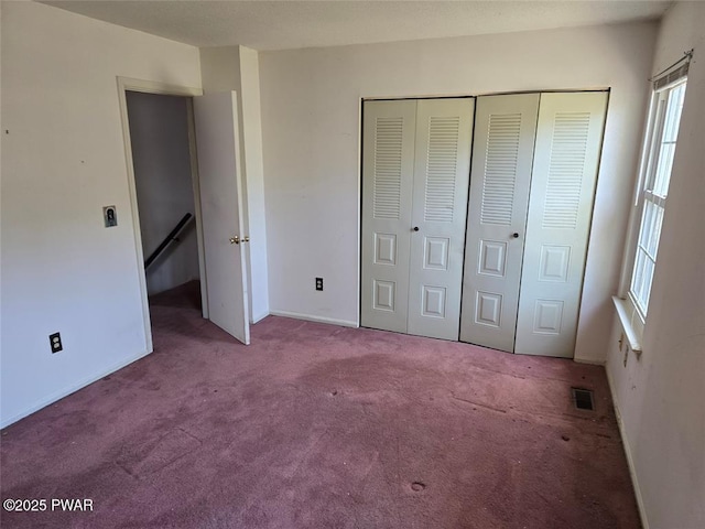 29 Burnett Way, Washingtonville, NY 10992 - unfurnished bedroom with a closet, baseboards, visible vents, and carpet floors