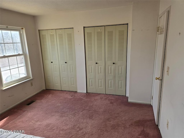 29 Burnett Way, Washingtonville, NY 10992 - unfurnished bedroom featuring carpet flooring, baseboards, visible vents, and multiple closets