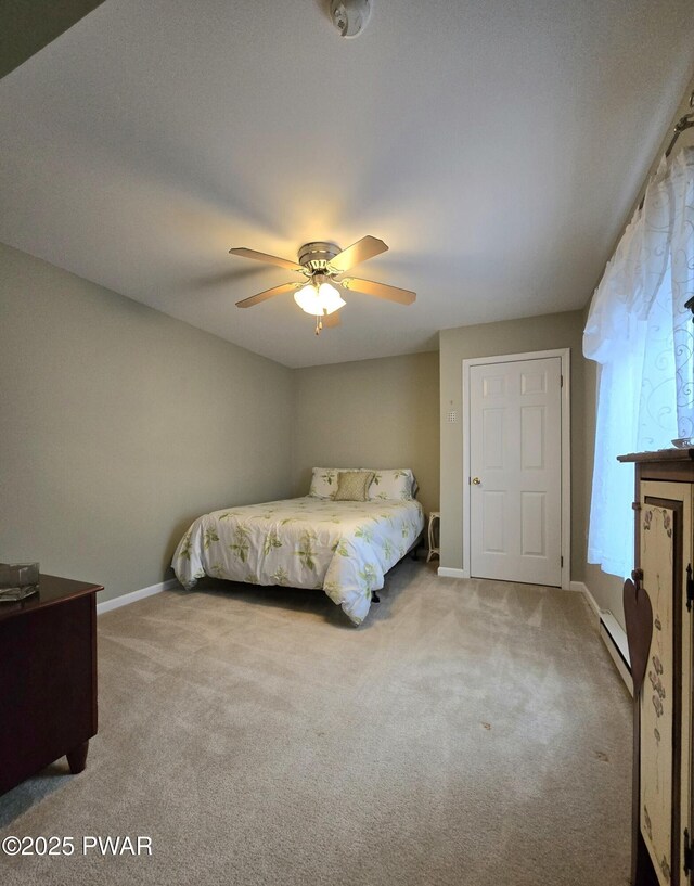 127 Maxatawny Dr, Pocono Lake, PA 18347 - bedroom featuring carpet floors, a baseboard radiator, and a ceiling fan