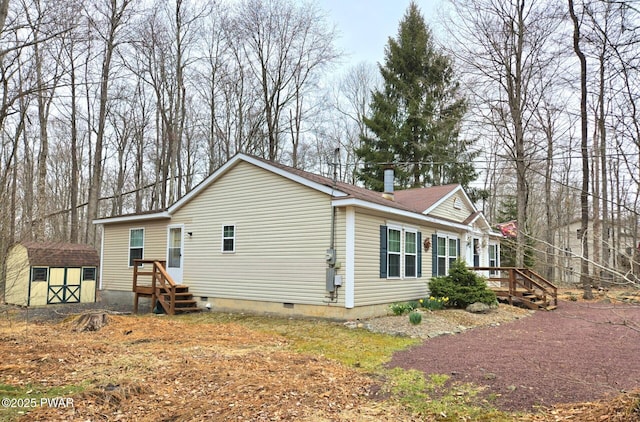 127 Maxatawny Dr, Pocono Lake, PA 18347 - view of property exterior with crawl space and a storage shed