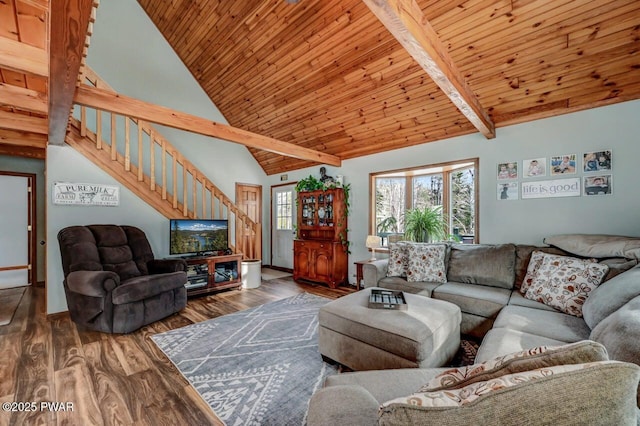 living area featuring stairway, wood finished floors, wooden ceiling, high vaulted ceiling, and beam ceiling