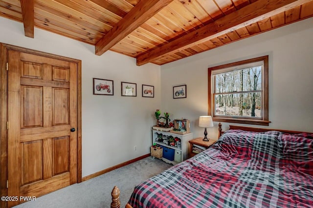 bedroom featuring carpet flooring, beam ceiling, baseboards, and wooden ceiling