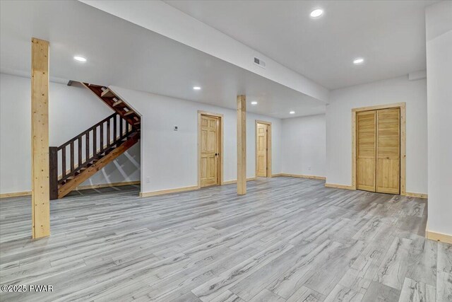 unfurnished living room with light wood-type flooring